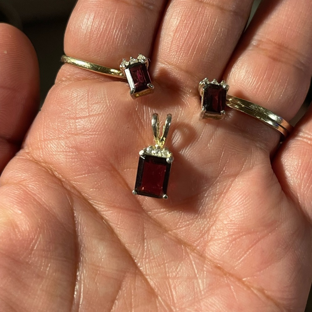 Red and Gold Gemstone Rings with Intricate Metalwork